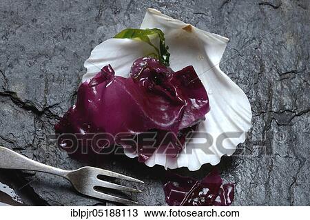 Stock Image - Red alga with sea salt in mussel shell and fork, Palmaria palmata, Wild Dulse. Fotosearch
