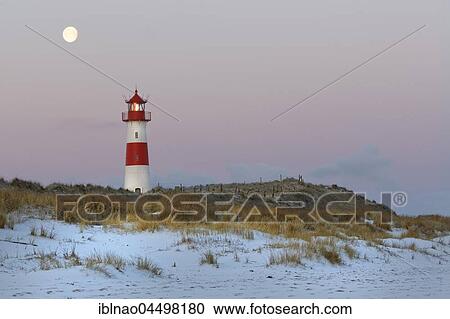 Red and white striped lighthouse List East in the dunes at the full moon, twilight, Ellenbogen, List, Sylt, North Frisia, Schleswig-Holstein, Germany, Europe View Large Photo Image Stock Image - Red and white striped lighthouse List East in the dunes at the full moon, twilight, Ellenbogen, List, Sylt, North Frisia, Schleswig-Holstein, Germany, Europe. Fotosearch