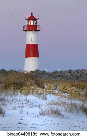Stock Photography - Red and white striped lighthouse List East in the dunes, Ellenbogen, List, Sylt, North Frisia, Schleswig-Holstein, Germany, Europe. Fotosearch