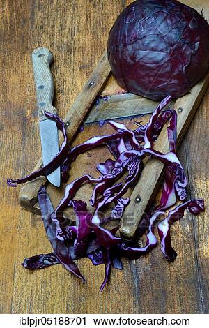 Stock Image - Red cabbage on grater, Brassica oleracea var. rubra. Fotosearch