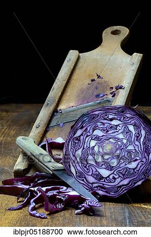 Stock Image - Red cabbage with grater, Brassica oleracea var. rubra. Fotosearch