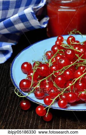 Stock Image - Red currants on plate. Fotosearch