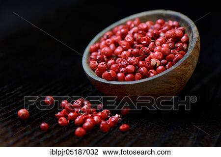Stock Image - Red pepper, Brazilian pepper (Schinus terebinthifolius). Fotosearch