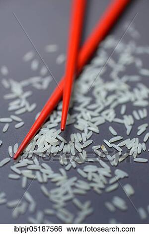 Rice grains and chopsticks, basmati rice, Oryza sativa, uncooked View Large Photo Image Stock Photograph - Rice grains and chopsticks, basmati rice, Oryza sativa, uncooked. Fotosearch