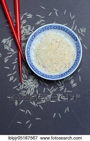 Rice grains in husk and chopsticks, basmati rice, Oryza sativa, uncooked View Large Photo Image Stock Photo - Rice grains in husk and chopsticks, basmati rice, Oryza sativa, uncooked. Fotosearch