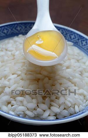 Rice syrup, rice syrup in spoon, rice in bowl, rice honey View Large Photo Image Stock Image - Rice syrup, rice syrup in spoon, rice in bowl, rice honey. Fotosearch