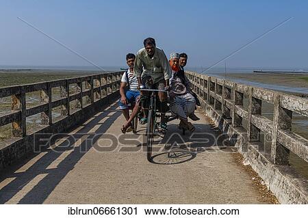 Rickshaw driver with several people on a Long pier in the Chittagong Ship Breaking Yard, Chittagong, Bangladesh, Asia View Large Photo Image Stock Image - Rickshaw driver with several people on a Long pier in the Chittagong Ship Breaking Yard, Chittagong, Bangladesh, Asia. Fotosearch
