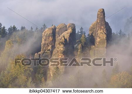 Rock serrated crown, Viererturm and Schramm gatekeepers in morning mist, Autumn, Elbe Sandstone Mountains, Saxon Switzerland, Saxony, Germany, Europe View Large Photo Image Stock Photo - Rock serrated crown, Viererturm and Schramm gatekeepers in morning mist, Autumn, Elbe Sandstone Mountains, Saxon Switzerland, Saxony, Germany, Europe. Fotosearch