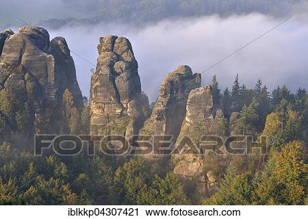 Rocks in morning mist, Autumn, Elbe Sandstone Mountains, Saxon Switzerland, Saxony, Germany, Europe View Large Photo Image Stock Image - Rocks in morning mist, Autumn, Elbe Sandstone Mountains, Saxon Switzerland, Saxony, Germany, Europe. Fotosearch