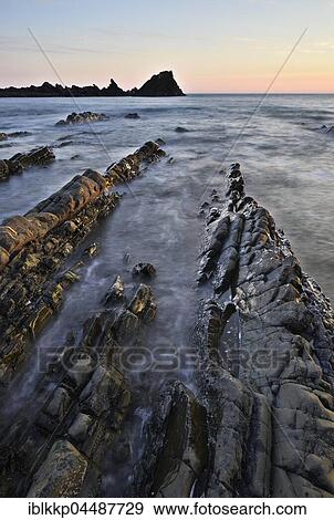 Stock Photo - Rocks in the sea, rocky coast, Atlantic Coast, Hartland Quay, Devon, United Kingdom, Europe. Fotosearch