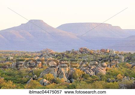 Stock Photo - Rocky landscape with Grootberg table mountain behind, Namibia, Africa. Fotosearch