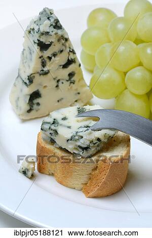 Roquefort on bread and fair, blue cheese, grapes, baguette View Large Photo Image Stock Image - Roquefort on bread and fair, blue cheese, grapes, baguette. Fotosearch