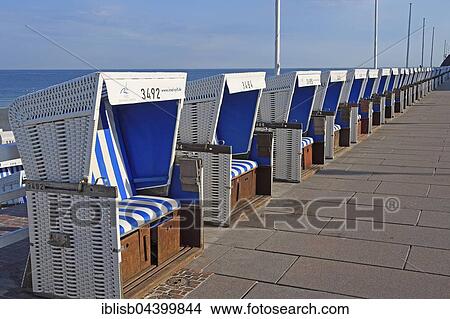 Row of beach chairs on the beach promenade of Westerland, Sylt, North Frisian Islands, North Frisia, Schleswig-Holstein, Germany, Europe View Large Photo Image Picture - Row of beach chairs on the beach promenade of Westerland, Sylt, North Frisian Islands, North Frisia, Schleswig-Holstein, Germany, Europe. Fotosearch