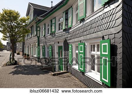 Row of houses with slate, Bergisch triad, the colors black, white and green, Radevormwald, Bergisches Land, North Rhine-Westphalia, Germany, Europe View Large Photo Image Stock Image - Row of houses with slate, Bergisch triad, the colors black, white and green, Radevormwald, Bergisches Land, North Rhine-Westphalia, Germany, Europe. Fotosearch