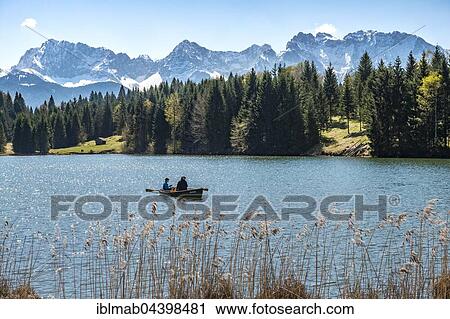 Rowboat on the Geroldsee, Wagenbrüchsee, Northern Karwendelkette, Werdenfelser Land, Upper Bavaria, Bavaria, Germany, Europe View Large Photo Image Stock Image - Rowboat on the Geroldsee, Wagenbrüchsee, Northern Karwendelkette, Werdenfelser Land, Upper Bavaria, Bavaria, Germany, Europe. Fotosearch