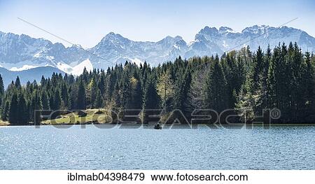 Rowboat on the Geroldsee, Wagenbrüchsee, Northern Karwendelkette, Werdenfelser Land, Upper Bavaria, Bavaria, Germany, Europe View Large Photo Image Stock Photo - Rowboat on the Geroldsee, Wagenbrüchsee, Northern Karwendelkette, Werdenfelser Land, Upper Bavaria, Bavaria, Germany, Europe. Fotosearch