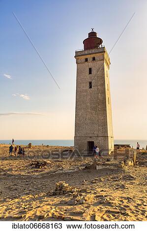 Stock Image - Rubjerg Knude lighthouse with visitors, evening mood, Løkken, Lokken, Nordjylland, North Jutland, Denmark, Europe. Fotosearch