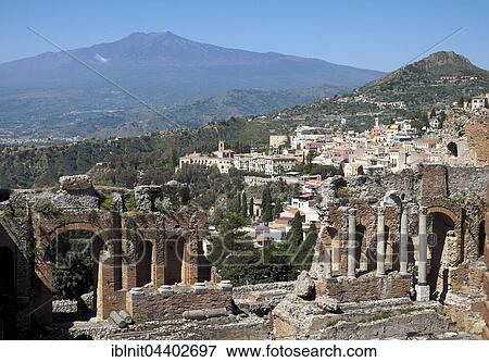 Stock Photo - Ruins of the amphitheater, Taormina, with Mount Etna, Sicily, Italy, Europe. Fotosearch