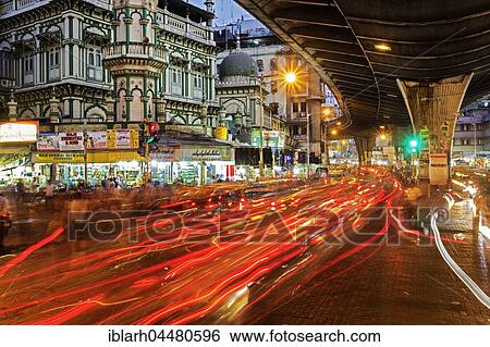 Stock Photograph - Rush hour, traffic, light strips in front of Minara Masjid mosque, dusk, district Pydhonie, Mumbai, Maharashtra, India, Asia. Fotosearch