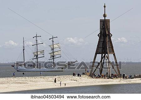 Sailing boat in front of Kugelbake, sea marks on the North Sea, Cuxhaven, Lower Saxony, Germany, Europe View Large Photo Image Picture - Sailing boat in front of Kugelbake, sea marks on the North Sea, Cuxhaven, Lower Saxony, Germany, Europe. Fotosearch