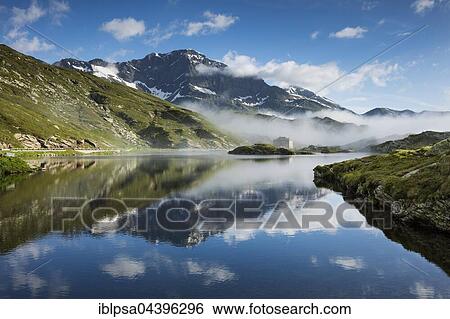 Stock Photograph - San Bernardino Pass with water reflection, Grison Alps, Graubünden Canton, Switzerland, Europe. Fotosearch