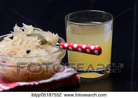 Stock Image - Sauerkraut and sauerkraut juice in glass. Fotosearch