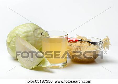 Stock Image - Sauerkraut and sauerkraut juice in glass, white cabbage. Fotosearch
