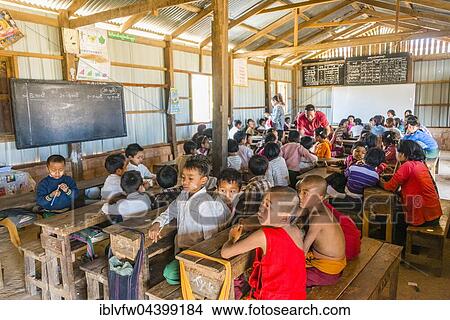 School children sitting at their desks, classroom, Shan State, Myanmar, Asia View Large Photo Image Picture - School children sitting at their desks, classroom, Shan State, Myanmar, Asia. Fotosearch