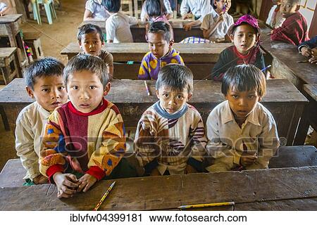 School children sitting at their desks, classroom, Shan State, Myanmar, Asia View Large Photo Image Stock Image - School children sitting at their desks, classroom, Shan State, Myanmar, Asia. Fotosearch