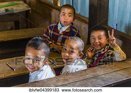 School children sitting at their desks, classroom, Shan State, Myanmar, Asia View Large Photo Image Stock Image - School children sitting at their desks, classroom, Shan State, Myanmar, Asia. Fotosearch