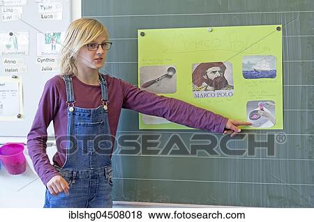 Stock Photo - Schoolgirl at the blackboard, giving a presentation, Primary School Lower Saxony, Germany, Europe. Fotosearch