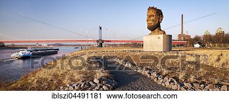 Stock Image - Sculpture echo of Poseidon, artist Markus Lüpertz, Mercator Island, Port of Duisburg, Ruhrort, Duisburg, Ruhr area, North Rhine-Westphalia, Germany, Europe. Fotosearch