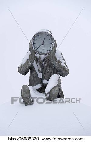 Sculpture holding a clock, covered with snow, standing at the river Elbe in Magdeburg, artwork by Gloria Friedmann, Magdeburg, Saxony-Anhalt, Germany, Europe View Large Photo Image Stock Image - Sculpture holding a clock, covered with snow, standing at the river Elbe in Magdeburg, artwork by Gloria Friedmann, Magdeburg, Saxony-Anhalt, Germany, Europe. Fotosearch