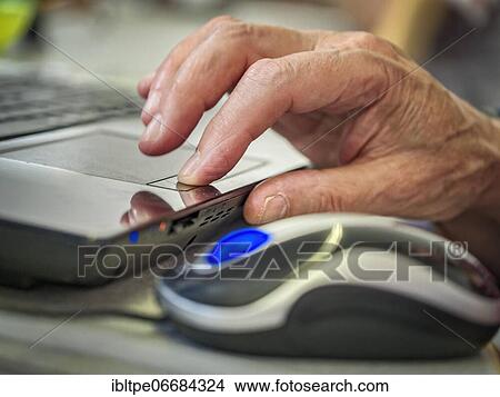 Seniors self-help dealing with computer, hand on trackpad, mouse Karlsruhe, Baden-Württemberg, Germany, Europe View Large Photo Image Picture - Seniors self-help dealing with computer, hand on trackpad, mouse Karlsruhe, Baden-Württemberg, Germany, Europe. Fotosearch