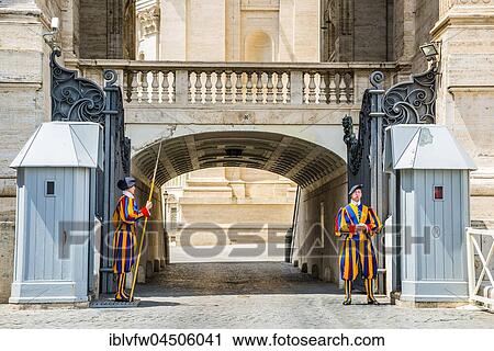 Stock Image - Sentry guards of the Swiss Guards at the Vatican Basilica, St. Peter's Square, Vatican city, Vatican, Rome, Lazio, Italy, Europe. Fotosearch