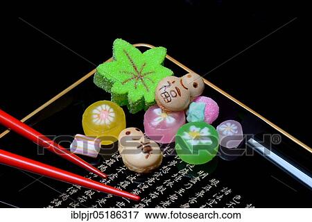 Stock Photo - shi, Japanese sweets on tray with characters, candy, sweets. Fotosearch