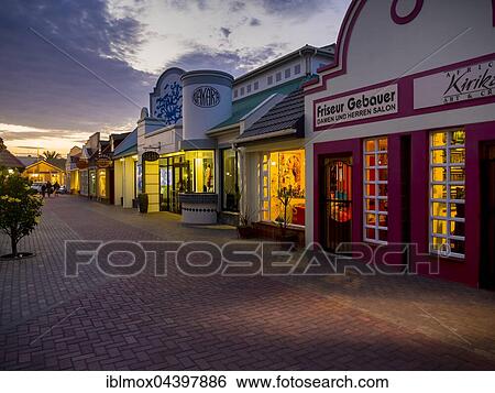 Stock Photograph - Shopping street in the twilight, Swakopmund, Erongo Region, Namibia, Africa. Fotosearch
