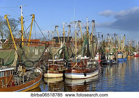 Shrimp boats in the harbor of Greetsiel, North Sea, Lower Saxony, Germany, Europe View Large Photo Image Stock Photography - Shrimp boats in the harbor of Greetsiel, North Sea, Lower Saxony, Germany, Europe. Fotosearch