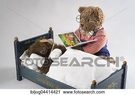 Sick Teddy Bear with head and paws bandaged, holding thermometer, in an original Pumuckl crib, Big Teddy Bear in glasses and bow tie reads from book View Large Photo Image Stock Image - Sick Teddy Bear with head and paws bandaged, holding thermometer, in an original Pumuckl crib, Big Teddy Bear in glasses and bow tie reads from book. Fotosearch