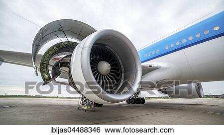 Stock Photograph - Side view of airplane's engine during maintenance, Schiphol Airport, Amsterdam, Netherlands. Fotosearch