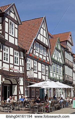 Picture - Sidewalk café in front of half-timbered houses, historic centre, Celle, Lower Saxony, Germany, Europe. Fotosearch