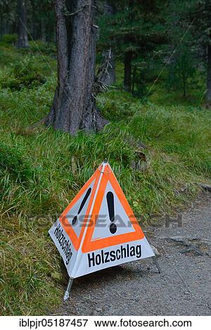 Stock Photo - Sign, logging, tree work, danger of accidents, advice. Fotosearch