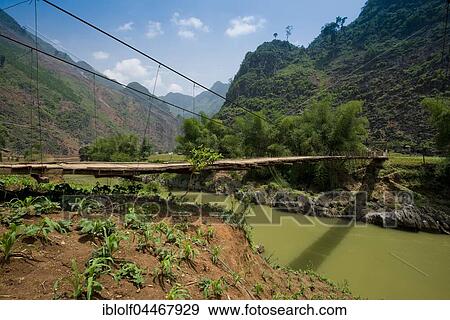 Stock Photo - Simple suspension bridge, Dong Van Karst Plateau, Ha Giang Province, northern Vietnam, Vietnam, Asia. Fotosearch