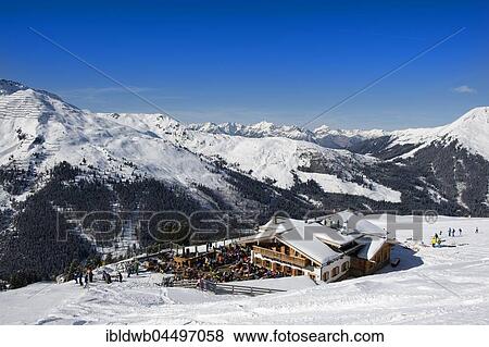 Skiers at Holzalm, Skiing area Hochfügen, Zillertal, Tyrol, Austria, Europe View Large Photo Image Stock Photo - Skiers at Holzalm, Skiing area Hochfügen, Zillertal, Tyrol, Austria, Europe. Fotosearch