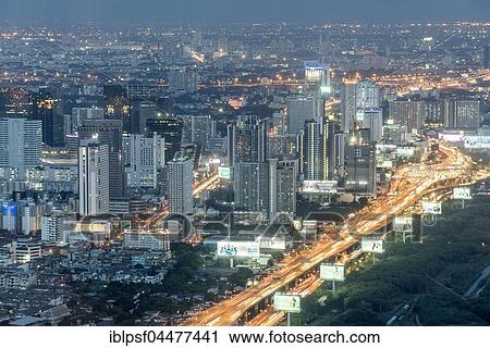 Skyline with skyscrapers, illuminated street, cityscape at dusk, Bangkok, Thailand, Asia View Large Photo Image Stock Image - Skyline with skyscrapers, illuminated street, cityscape at dusk, Bangkok, Thailand, Asia. Fotosearch