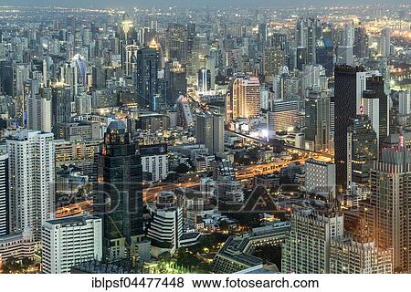 Skyline with skyscrapers, illuminated street, cityscape at dusk, Bangkok, Thailand, Asia View Large Photo Image Stock Photo - Skyline with skyscrapers, illuminated street, cityscape at dusk, Bangkok, Thailand, Asia. Fotosearch