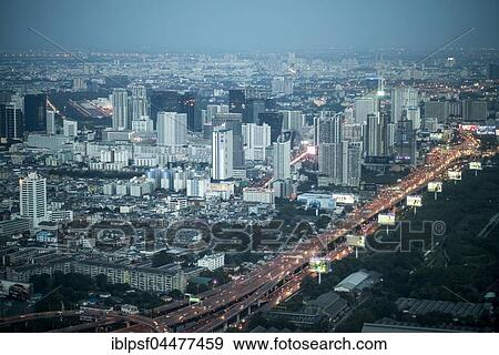 Skyline with skyscrapers, illuminated street, cityscape at dusk, Bangkok, Thailand, Asia View Large Photo Image Stock Photo - Skyline with skyscrapers, illuminated street, cityscape at dusk, Bangkok, Thailand, Asia. Fotosearch