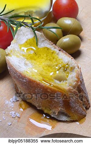 Slice of bread with olive oil, Mediterranean, Mediterranean diet, rosemary View Large Photo Image Stock Photography - Slice of bread with olive oil, Mediterranean, Mediterranean diet, rosemary. Fotosearch