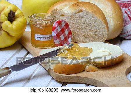 Stock Image - Slice of butter plait with quince jelly, quince jelly, Cydonia oblonga. Fotosearch