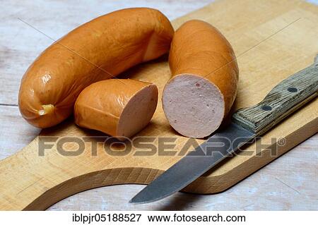 Sliced meat sausage on wooden board, Swiss Cervelat View Large Photo Image Stock Photo - Sliced meat sausage on wooden board, Swiss Cervelat. Fotosearch